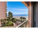 Stunning ocean view from balcony, showcasing beach and palm trees at 1310 Gulf Blvd # 4-G, Clearwater, FL 33767