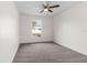 Spacious bedroom with a large window and neutral carpeting at 1360 Franklin Ln, North Port, FL 34286