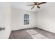 Bright bedroom with ceiling fan and plush carpeting at 1360 Franklin Ln, North Port, FL 34286