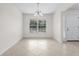 Spacious dining area with large window and tile flooring at 1360 Franklin Ln, North Port, FL 34286