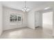 Bright dining room featuring tile floors and a chandelier at 1360 Franklin Ln, North Port, FL 34286