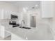 Modern kitchen with white cabinets and quartz countertops at 1360 Franklin Ln, North Port, FL 34286