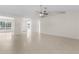 Spacious living room with tile floors and high ceilings at 1360 Franklin Ln, North Port, FL 34286