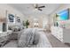 Main bedroom with coastal decor and ceiling fan at 1360 Franklin Ln, North Port, FL 34286