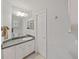 Neat bathroom with single vanity and shower at 13804 Mill Cove Cir, Tampa, FL 33618