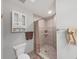 Bathroom with shower, toilet and linen cabinet at 13804 Mill Cove Cir, Tampa, FL 33618