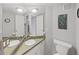 Bright bathroom with double sinks and updated fixtures at 13804 Mill Cove Cir, Tampa, FL 33618