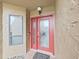 Inviting red front door with glass accents and a welcoming entryway at 13804 Mill Cove Cir, Tampa, FL 33618