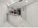 Modern kitchen with white cabinets and black appliances at 13804 Mill Cove Cir, Tampa, FL 33618