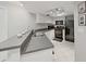 Modern kitchen with breakfast bar and black appliances at 13804 Mill Cove Cir, Tampa, FL 33618