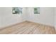 Simple bedroom with light walls and wood-look flooring at 1400 Farragut Dr, St Petersburg, FL 33710