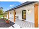 Welcoming front entrance with modern door and wood columns, showcasing updated design at 1400 Farragut Dr, St Petersburg, FL 33710