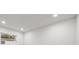 Bright, white interior room with a window and recessed lighting at 1400 Farragut Dr, St Petersburg, FL 33710