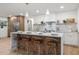 Modern kitchen with island, quartz countertops, and stylish pendant lighting at 1400 Farragut Dr, St Petersburg, FL 33710