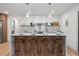 Modern kitchen with island, quartz countertops, and stylish pendant lighting at 1400 Farragut Dr, St Petersburg, FL 33710