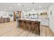 Modern kitchen with island, quartz countertops, and stylish pendant lighting at 1400 Farragut Dr, St Petersburg, FL 33710