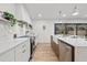 Modern kitchen with stainless steel appliances and marble countertops at 1400 Farragut Dr, St Petersburg, FL 33710