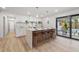 Modern kitchen with island, quartz countertops, and stylish pendant lighting at 1400 Farragut Dr, St Petersburg, FL 33710