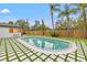 Landscaped backyard with inviting pool and patio area at 1400 Farragut Dr, St Petersburg, FL 33710