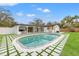 Inviting pool with surrounding patio and grassy area at 1400 Farragut Dr, St Petersburg, FL 33710