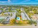 Aerial view showcasing building, pool, and location at 14130 Rosemary Ln # 2203, Largo, FL 33774