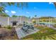 Outdoor BBQ area with picnic tables and a grill at 14130 Rosemary Ln # 2203, Largo, FL 33774