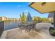 Private patio with table and chairs overlooking lake at 14130 Rosemary Ln # 2203, Largo, FL 33774