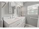 Updated bathroom with double vanity and quartz countertop at 1415 Ridge Ave, Clearwater, FL 33755