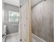 Clean bathroom with shower/tub combo and updated tile at 1415 Ridge Ave, Clearwater, FL 33755