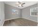 Spacious bedroom with ceiling fan and wood-look flooring at 1415 Ridge Ave, Clearwater, FL 33755