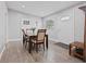 Cozy dining area with hardwood floors and a modern dining set at 1415 Ridge Ave, Clearwater, FL 33755