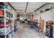 Garage with washer, dryer, and ample storage shelving at 1415 Ridge Ave, Clearwater, FL 33755