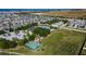 Aerial view of community amenities including basketball court and dog park at 14525 Scottburgh Glen Dr, Wimauma, FL 33598