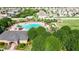 Resort-style pool with lounge chairs and a clubhouse at 14525 Scottburgh Glen Dr, Wimauma, FL 33598