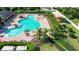 Resort-style pool with lounge chairs and a shaded play area at 14525 Scottburgh Glen Dr, Wimauma, FL 33598