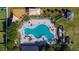 Overhead view of a resort-style community pool and surrounding amenities at 14525 Scottburgh Glen Dr, Wimauma, FL 33598