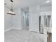 Bright dining room with tile floors and a modern chandelier at 14525 Scottburgh Glen Dr, Wimauma, FL 33598