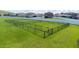 Fenced dog park with separate areas for small and large dogs at 14525 Scottburgh Glen Dr, Wimauma, FL 33598