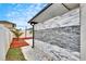 Outdoor shower with stone wall and tiled floor at 14525 Scottburgh Glen Dr, Wimauma, FL 33598