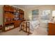 Cozy bedroom with built-in shelving and backyard view at 16809 Woburn Ln, Lutz, FL 33549