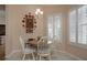 Charming breakfast nook with a rustic table and chairs at 16809 Woburn Ln, Lutz, FL 33549