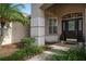 Elegant front entryway with double doors and landscaping at 16809 Woburn Ln, Lutz, FL 33549