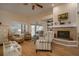 Comfortable living room featuring a fireplace and hardwood floors at 16809 Woburn Ln, Lutz, FL 33549