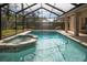 Relaxing screened pool and spa with tiled coping at 16809 Woburn Ln, Lutz, FL 33549