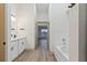 Modern bathroom with soaking tub and double vanity at 1946 Hammocks Ave, Lutz, FL 33549