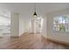 Open concept dining area with wood-look floors and kitchen views at 1946 Hammocks Ave, Lutz, FL 33549