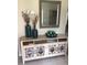 Decorative console table with storage and mirror at 2217 Sequoia Dr, Clearwater, FL 33763