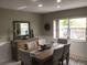 Bright dining room with wooden table and chairs at 2217 Sequoia Dr, Clearwater, FL 33763