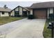 House with driveway and mailbox in front yard at 2217 Sequoia Dr, Clearwater, FL 33763