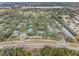 Wide aerial view of community and surrounding area at 2670 Sequoia Ter # 1406, Palm Harbor, FL 34683